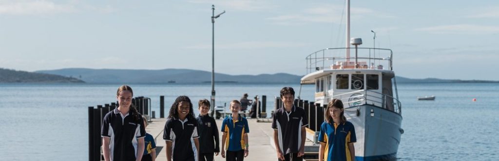 Children walking along a jetty.